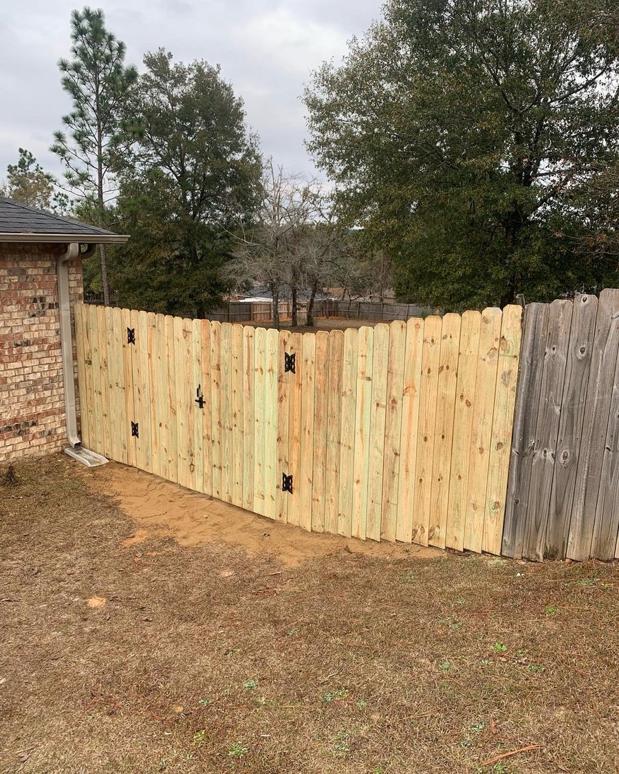 New wood fence with a double gate built by KM